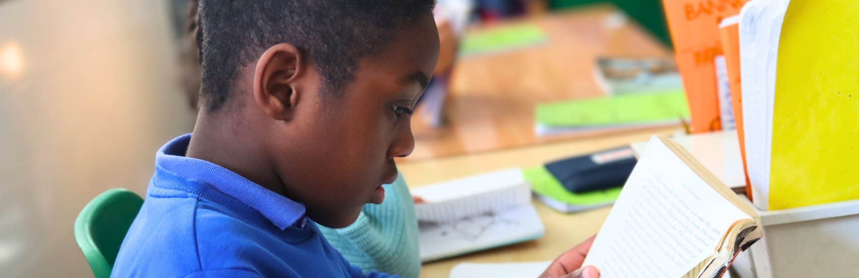CHILD READING A BOOK